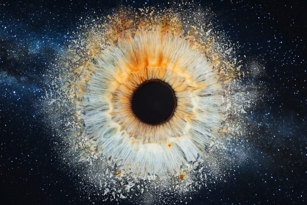 Light blue iris with orange areas exploding on a space background. Haverhill, Suffolk Iris Photography Pop Up Event Gallery